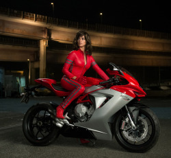 designerleather:  Some leather love… for Penelope Cruz in Zoolander 2. Red leather suit reminds me of Liz Hurley in red leather Versace for Bedazzled - also love the MV Agusta F3