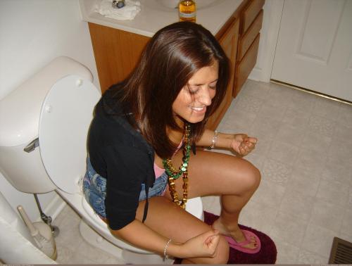 Girls caught peeing on toilet
