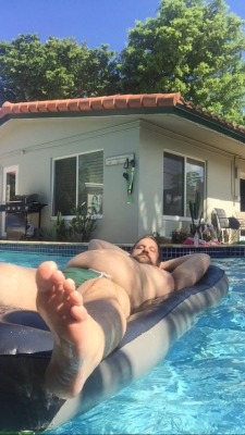 thatonebigcub:  Daddy has been feeding me all day. Keeping me stuffed and half-naked by the pool. Growing his boy