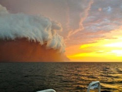 Nature’s terrifying beauty (a red dust storm sweeps off Australia’s west coast out over the ocean near the town of Onslow 09Jan2013)