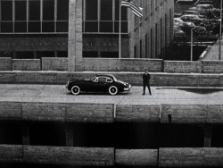 architectureofdoom:  Paul Rudolph atop his Temple Street Garage, New Haven, 1962  Man had taste in wheels, too&hellip;