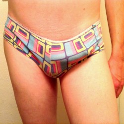 thetrappistmonk:  I decided it was time to show off my other panties, these being colorful boy shorts. They’re softer but more difficult to keep my dick in, especially when it’s hard. I provided an ass shot too. In the last pic, you can see that wearing