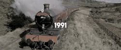 ravnclaws:       A scarlet steam engine was waiting next to a platform packed with people.          A sign over head said Hogwarts Express, 11 o'clock. 