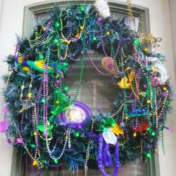 I love the French Quarter&rsquo;s passion for decorating during #mardigras in #NewOrleans. #nola #FrenchQuarter #mardigras2016 #wreath #holidaydecorations #cheer #flair #martiniglass #beads #paradethrows #throws