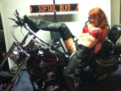 A hot, mature Heavenly Redheads fan on a Harley, spreading her legs.