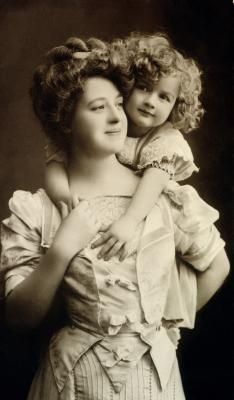 hoopskirtsociety:  Mother and child photos. Edwardian era 1900s. It’s rare to find a photo of a woman smiling since taking photos took so long.