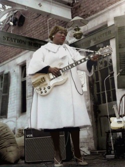 vaticanrust: Sister Rosetta Tharpe. Manchester, 1964  There’s footage of this performance on YouTube.  That’s a train station she’s playing in front of; the audience is a bunch of English kids sitting in bleachers *literally* on the other side of
