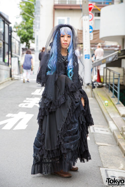 tokyo-fashion:  Keke wearing lolita fashion on the street in Harajuku with a Black Peace Now corset top, black lace skirt and lace jacket from Dangerous Nude Harajuku, and Nude Sox graphic tights. Full Look