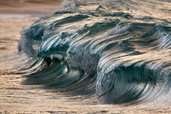 archiemcphee:  These awesome photos, in which rolling waves appear to be both perfectly frozen in time and miraculously made solid, are the work of French photographer Pierre Carreau. Carreau “shoots waves with a variety of high speed cameras using