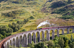 en-omgb:  Ride the Hogwarts Express!Glenfinnan Viaduct, Scotland The Jacobite steam train is a great way to experience the stunning scenery and special atmosphere of Glenfinnan. You may even recognise it from Harry Potter! Photo by Colin Roberts - More