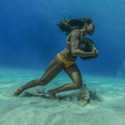 stunningpicture:  Hawaiian surfer Ha’a Keaulana runs across the ocean floor with a 50 pound boulder, as training to survive the massive surf waves 