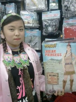 disgustinghuman:  lastrealindians:  On her way to the Black Hills powwow this past weekend Asia Black Bull, (Lakota/Korean) a jingle dress dancer and current Miss Teen Rosebud from the Rosebud Rez, and her family stopped to pick out a Halloween costume.