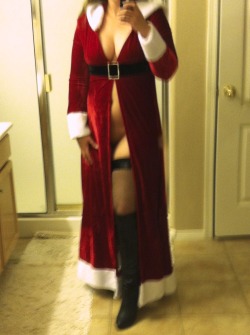 wordsmatty:  And to celebrate the glory that is Thigh High Thursday, here is a picture of my lovely wife in her Mrs. Clause outfit, thigh highs and a pair of boots that always gets blood pumping.  This was our very first submission ever, and it went to