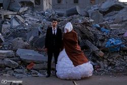 revolutionary-arab-unicorn:  nasheed-al-mawta:  A married couple standing in front of their “house” which got demolished by the israeli airstrikes in July, 2014.     