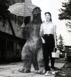 Godzilla holding an umbrella, 1954.