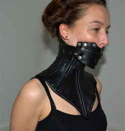 fucktoy1013: happytouseyou:  kinkyplace:  More Kinky Pics and Vids  Thoughts? @fucktoy1013   it looks attractive, nice panel gag. Is the neck corset stiff enough or is it a fashion one? 
