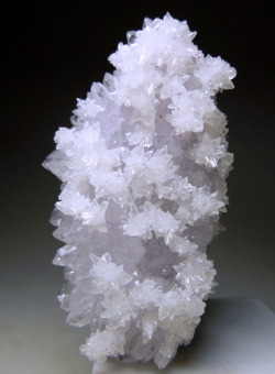 mineralists:  Light Lavender pink Amethyst partially covered with colorless star shaped Calcite Clusters.2nd photo is showing the Fluorescence of this specimen! Valenciana Mine, Mexico