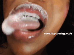 Playing with her creamy discharge on her lips.