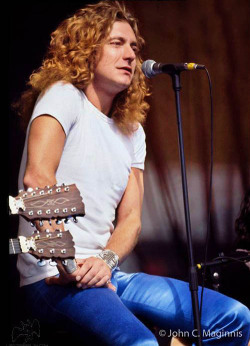 soundsof71:  Robert Plant, Oakland, July 24, 1977, by John C. Maginnis. No, not the iconic Nurse shirt of the day before, but I think the Plain White T looks mighty, mighty fine too.