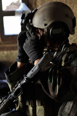 house-of-gnar:  A US Army Special Forces soldier with Special Operations Task Force- East  uses his helmet-mounted binoculars to scan for threats during a battle in the Barge Matal District, May 2011. DoD photo sourced from public domain