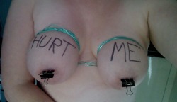 whoresjourney:  Photo request “Hurt me”. A combination of being asked to put binder clips on my nipples and being asked to tie cord around them and write “hurt me”.