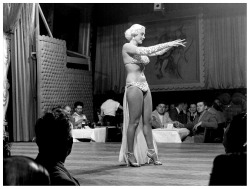 Mae Blondell         aka. “The Statuesque Blonde”..Dancing on stage for patrons at a Chicago nightclub, sometime in 1952..