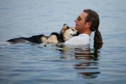  Schoep, a 19 year old dog, is taken into the lake every night by his owner, John, to help soothe his arthritis and help him fall asleep. 