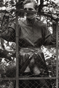 helmutnewtonphoto:  1975 Roselyne behind fence, Château d'Arcangues.