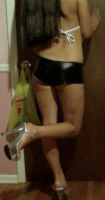 wannabeslutty:  this has got to be my most slutty outfit to date… shiny “leather” booty shorts, my mesh string bikini top, and my stripper heels (2” platform, 6” heel) thanks for all the love and 6666 followers! 