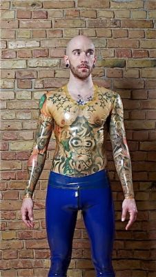 sweatylatex:  cjros:  I mostly wanted to show this transparent, longsleeve V-neck shirt from RubAddictions because of this guy’s tattoos. I’m not especially excited by tattoos (though they don’t hurt), nor do I want tattoos (mostly because I don’t