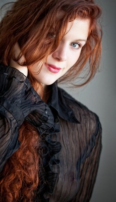 Stunning redhead with amazing eyes.