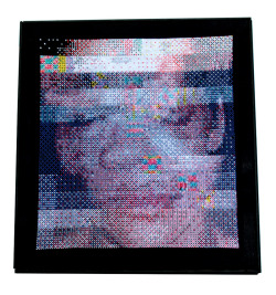 prostheticknowledge:  Rhianna (after Chris Brown)  Andrew Healy aka virtualsurface turns famous photo into large dithered glitch cross-stitch:  Counted cross stitch on 14ct black aida, Wooden frame (42x39 cm). This image of Rhianna’s bruised face is