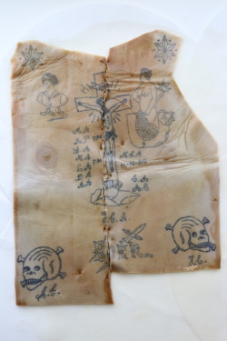 ttrincea:  The tattooed chest of a portuguese criminal who died in Lisbon circa 1880. The identity of the man is not known. The tattooed skin was removed from the body to avoid detection in dissections, as the bodies of criminals and outlaws were used