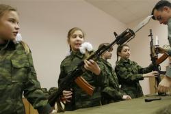 gunrunnerhell:  Meanwhile in Russia… Girls learn to disassemble and re-assemble Kalashnikov rifles during a lesson at the cadets’ boarding school No. 9 for girls in Moscow, Nov. 26, 2005. The school offers its pupils a strong spirit of discipline