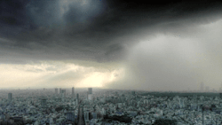 londonfrequency:  iampetershervheim:  rkidd:  d0esntmakesense:  This is probably the coolest GIF I’ve ever seen.  now there’s some perspective.  I once saw a storm roll like this once. It was beautiful.  It was sunny as my friend and I were walking