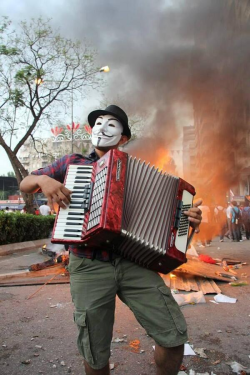 occupygezipics:  A man plays the accordion in Adana behind the barricades. 