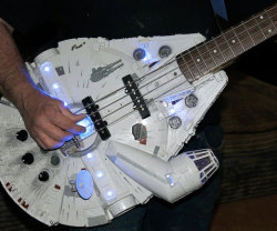 awesomeshityoucanbuy:  Millennium Falcon Bass GuitarMelt faces off in less than 12 parsecs when you commandeer the Millennium Falcon bass guitar. Upon seeing you take to the stage with an illuminated Millennium Falcon, all the intergalactic groupies will