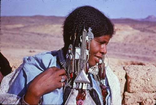 mydearalgeria:  Algeria. Portrait of a Tuareg woman from Tahart near Tamanrasset wearing traditional jewelry - 1975.Henri Bancaud.
