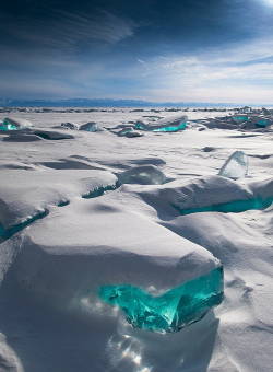 oecologia:  “In March, due to a natural phenomenon, Siberia’s Lake Baikal is particularly amazing to photograph. The temperature, wind and sun cause the ice crust to crack and form beautiful turquoise blocks or ice hummocks on the lake’s surface.”