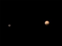 thesciencewhiz:  First ever clear image of Pluto and Charon  When New Horizons goes past Pluto in four days, it will be 50 years to the day that Mariner took it’s first pictures of Mercury.