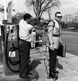 A 1950s salesman gets his motorized skates refuelled. For real.