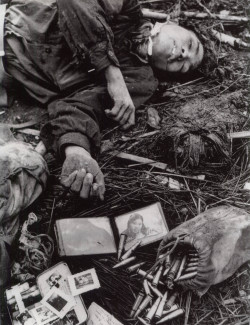 historicporn:  North Vietnamese solider lays with his belongings after death.1968.  When I was a teenager I had this picture taped to my wall.