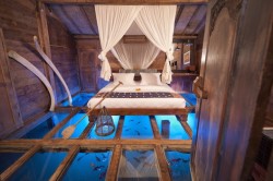 culturenlifestyle:  Luxurious Hotel Bedroom Reveals Glass Floor With a Peak Into the Underwater  Located in Bali, there exists one of the most exquisite and unique bedrooms in the world. The Bambu Indah eco-luxury boutique hotel in Ubud, Bali offers
