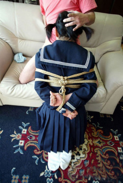 japanese schoolgirl in rope bondage giving a blowjob