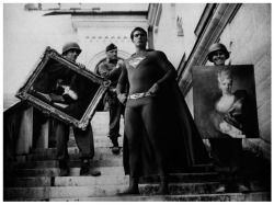 Neuschwanstein 1945 Soldiers from the 7th US Army carry the priceless artworks down the steps of Meunschwanstein Castle where hoards of European art treasures, stolen by the Nazis, were hidden during World War II. by Agan Harahap, Super Hero series, 2009