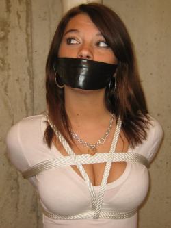 lordofthehogtiedgirl:  auctionhouse69:  johnnyadidas:  (via simplybondage, racemason-deactivated20100820-d)  (via johnnyadidas) She strains to here the negotiations. White slavery? It’s real? Maybe if she can convince her new owner to let her help,