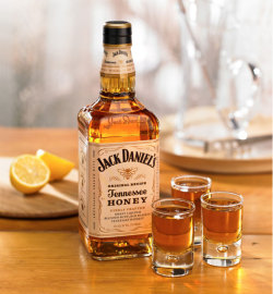 Jack Daniel&rsquo;s Tennessee Honey package design  A brand-new honey liqueur made with Jack Daniel&rsquo;s whiskey. This product is targeted to people who like the Jack brand but are not whiskey drinkers. The design communicates a light, smooth flavor