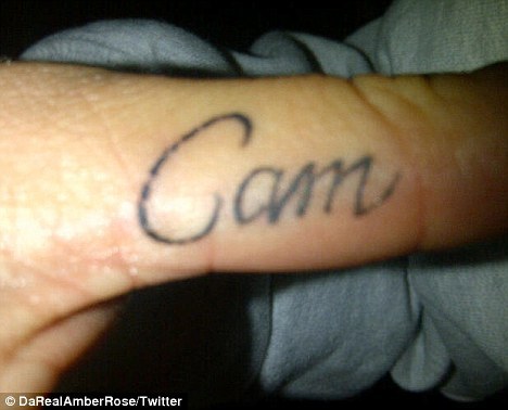 Woman cuts off boyfriends name tattoo