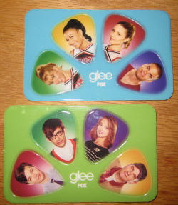 allthegirlsarebummers:  These are two of the four cards they were giving out at the Glee panel at Comic-Con 2011. I got one of them and my friend who was also there but not a big Glee fan gave me hers, so now I have two! And I don’t play guitar so I’m