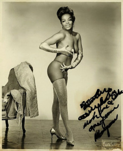 Nice photo of an unknown black showgirl.. With a completely illegible inscription..
